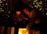 Child and father lighting candle for Earth Hour